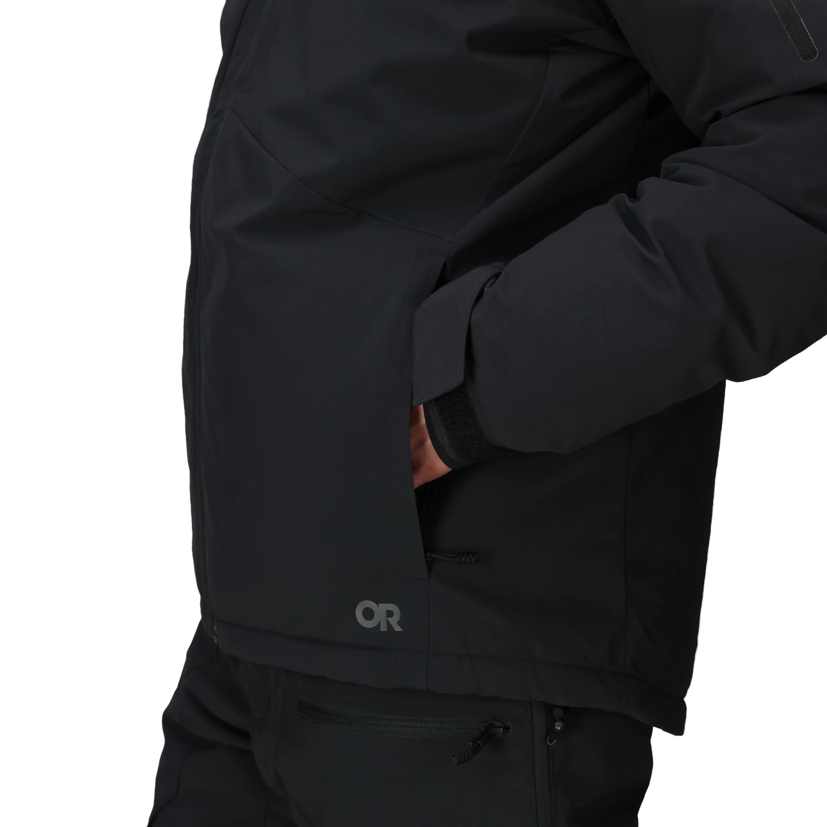 Detail view of the Outdoor Research Allies Colossus II Parka showing insulated front hand pockets, designed for warmth, secure storage, and easy access during Arctic expeditions, military missions, and extreme cold weather survival.