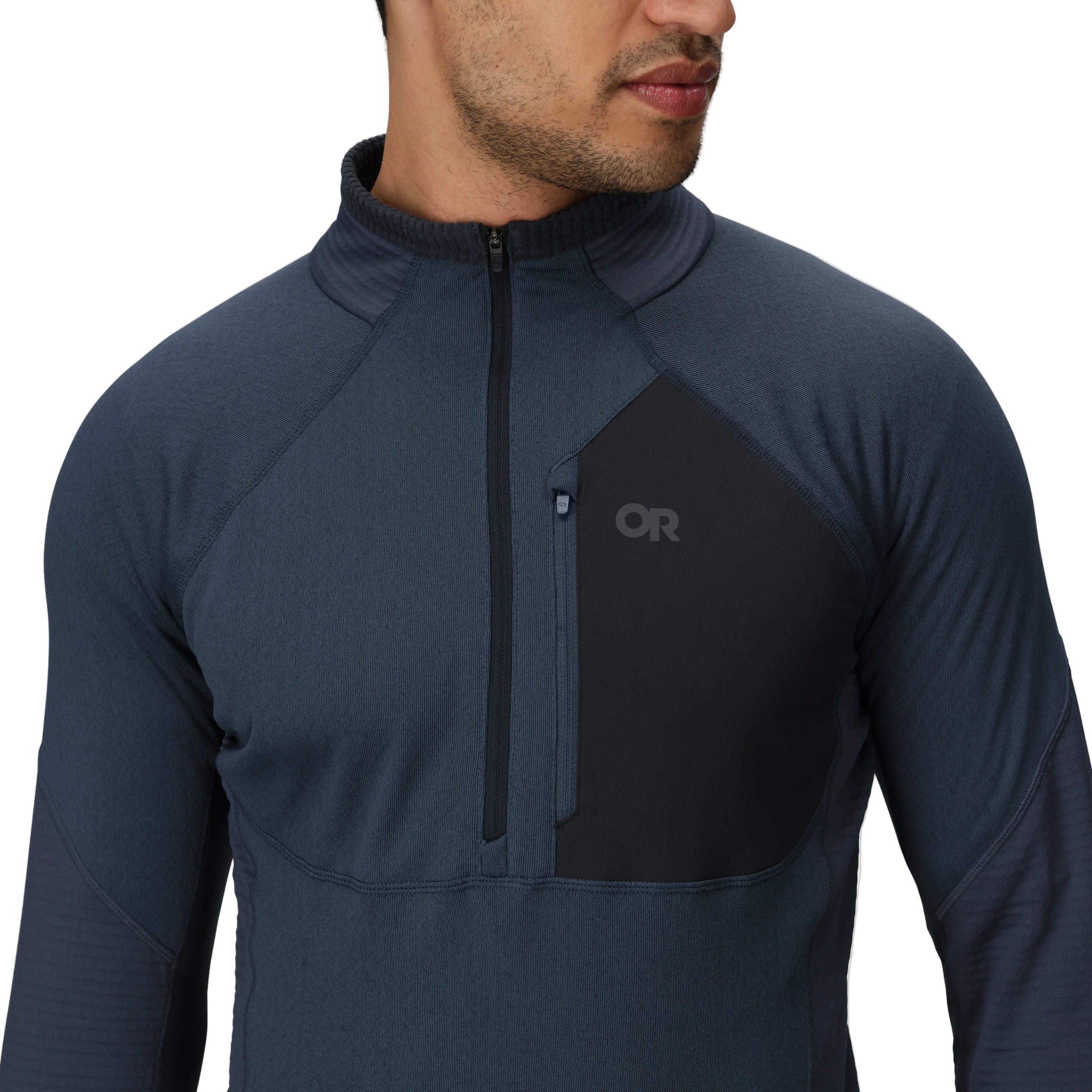 Close-up detail of the Outdoor Research Deviator Fleece Half Zip, showing the zippered chest pocket and 13-inch front half zipper for secure storage and adjustable venting during high-output cold-weather pursuits.