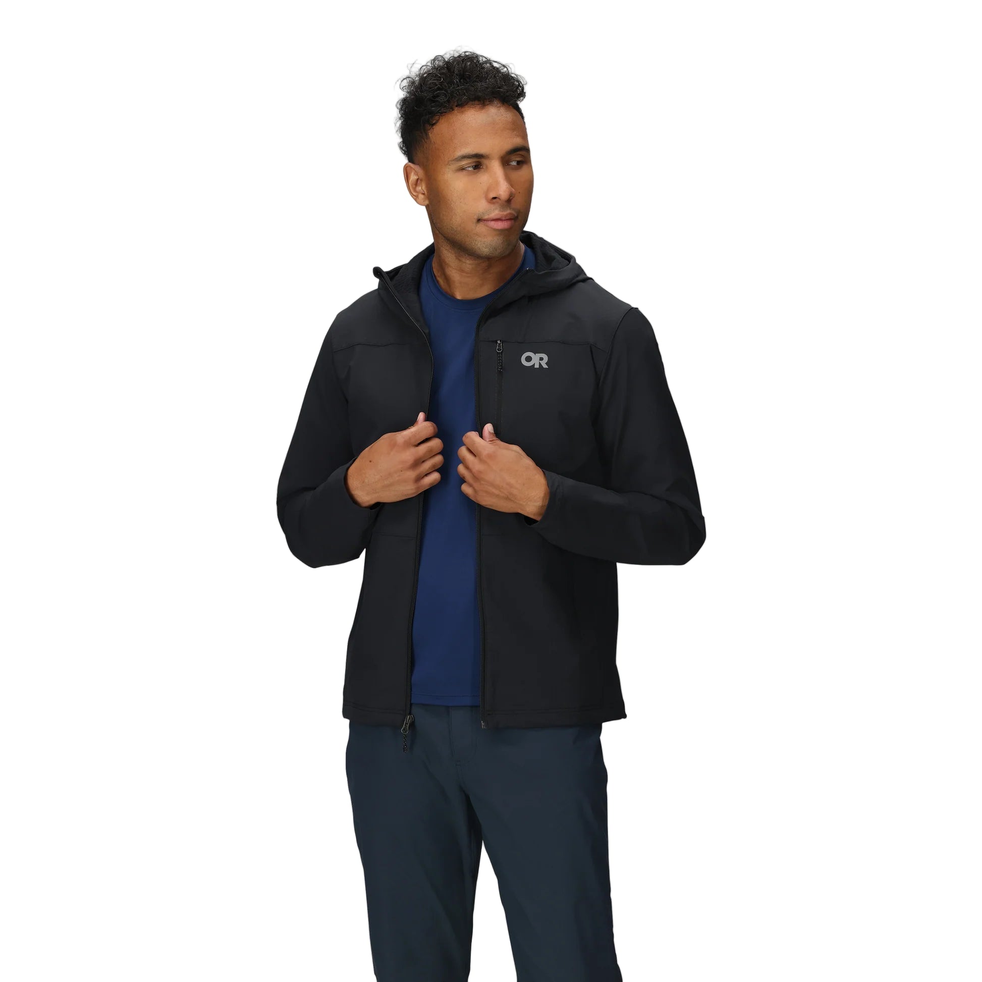Outdoor Research Ultima Soft Shell Hoodie in black shown unzipped on a model, highlighting brushed fleece interior, breathable comfort, and versatile layering for alpine and trail missions.