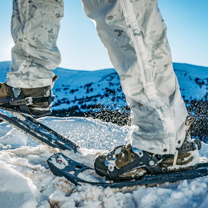 Salomon Quest 4D Forces 2 Boots used in snowy terrain, demonstrating traction and stability in cold-weather conditions.