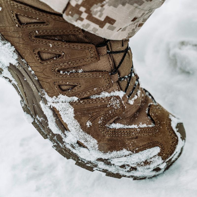 Salomon XA Forces Mid boots providing traction and stability while entering and exiting vehicles during tactical operations.