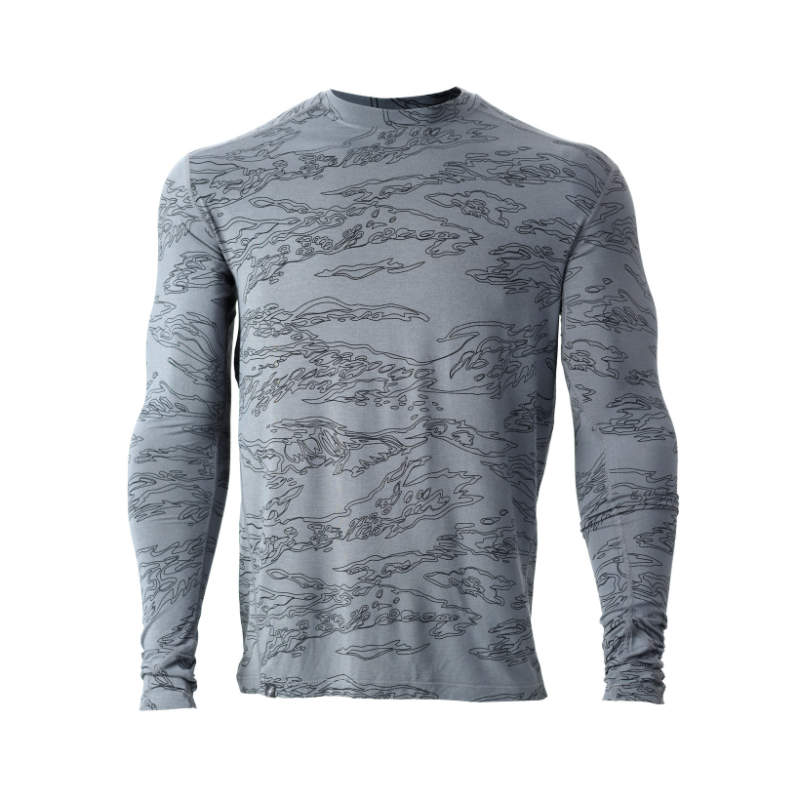 Front view of the TD Base Layer Long Sleeve Top in Shadow Tiger Stripe displaying the temperature regulating Merino bamboo blend, thumbhole cuffs, and movement focused athletic cut built for mission ready comfort.