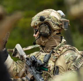 Shaw Concepts BRAIN Pouch worn in the field on tactical helmet as NVG counterweight and battery storage pouch, low profile helmet accessory built for military combat gear, law enforcement duty operations, and real world night vision field deployments made in the USA