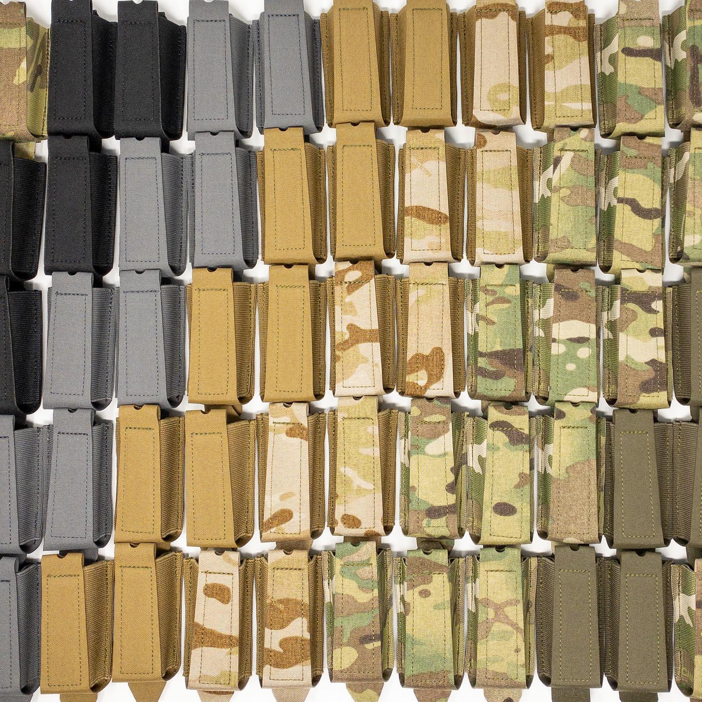 Flat lay of Shaw Concepts Double Elastic Pistol Pouch in Multicam, Coyote, Ranger Green, Black, and Wolf Grey, low profile elastic double stack pistol magazine holders with MOLLE PALS mounting and HANK friction liner for tactical belts, plate carriers, and combat gear setups made in the USA