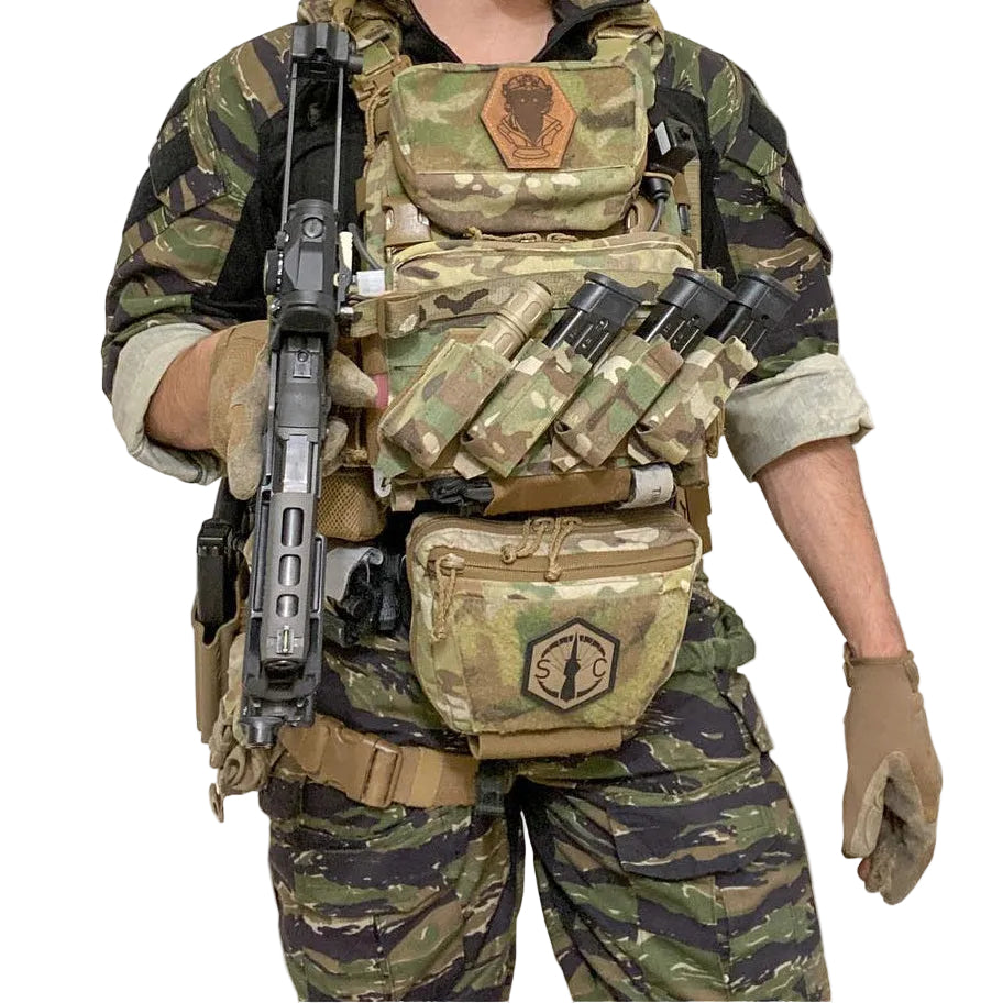 Operator wearing Shaw Concepts Double Elastic Pistol Pouch mounted on plate carrier or battle belt, low profile elastic pistol magazine holder with high retention HANK liner integrated into combat gear, military loadouts, and law enforcement duty setups made in the USA