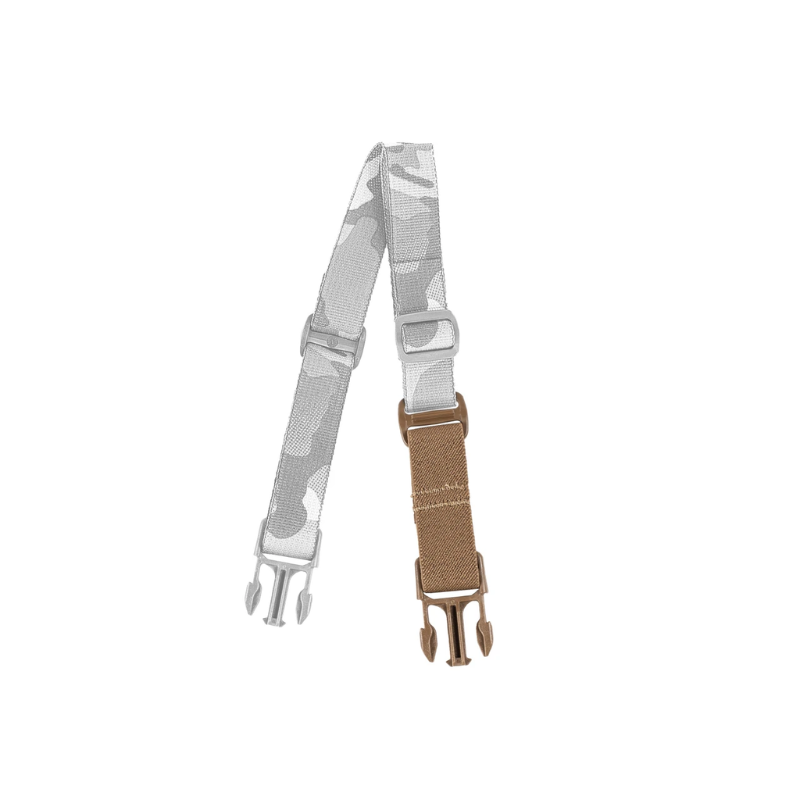 Spiritus Systems Elastic Strap Extender in Coyote Brown attached to a camouflage chest rig back strap, demonstrating how the extender adds flexibility to the setup.