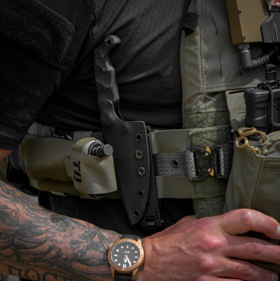 Stroup Knives Bravo 5 compact 1095 fixed blade mounted on tactical plate carrier using Kydex sheath for rapid access