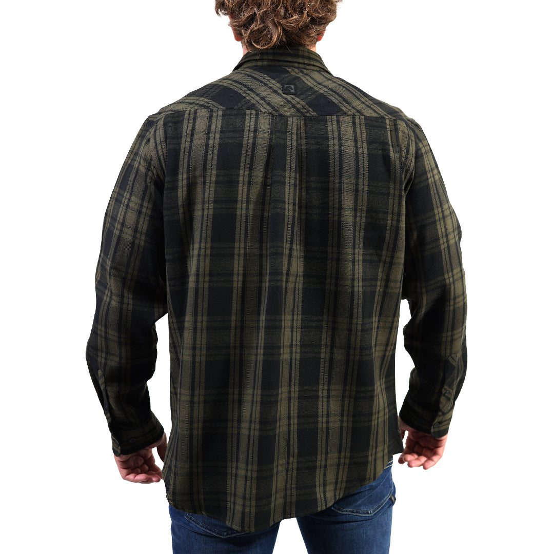 A man viewed from the back wearing a dark green and black plaid flannel shirt with blue jeans, set against a plain white background.