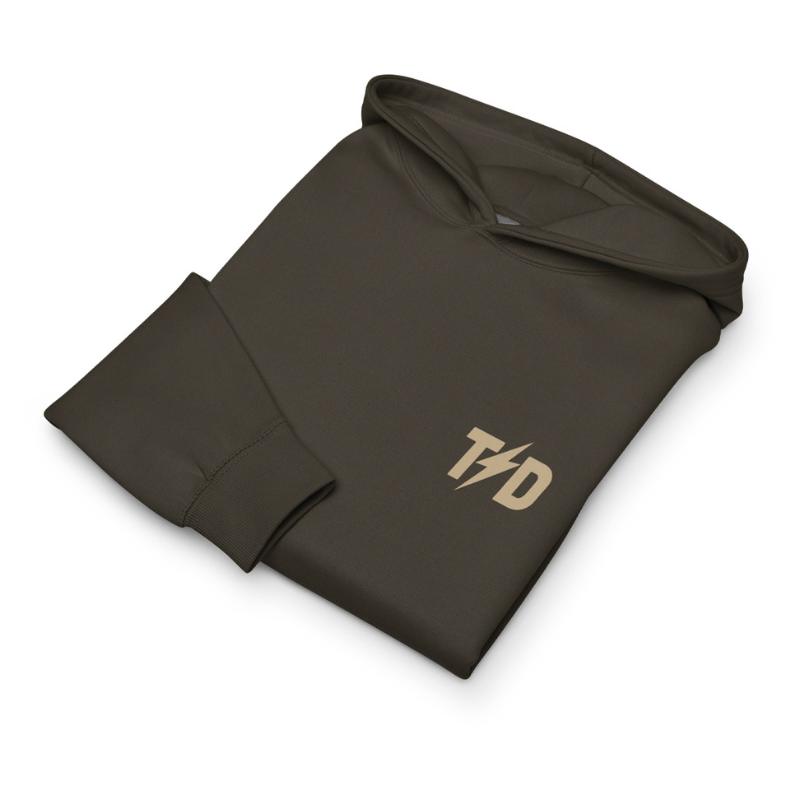 Folded gunmetal hoodie with 'TD' logo on a white background