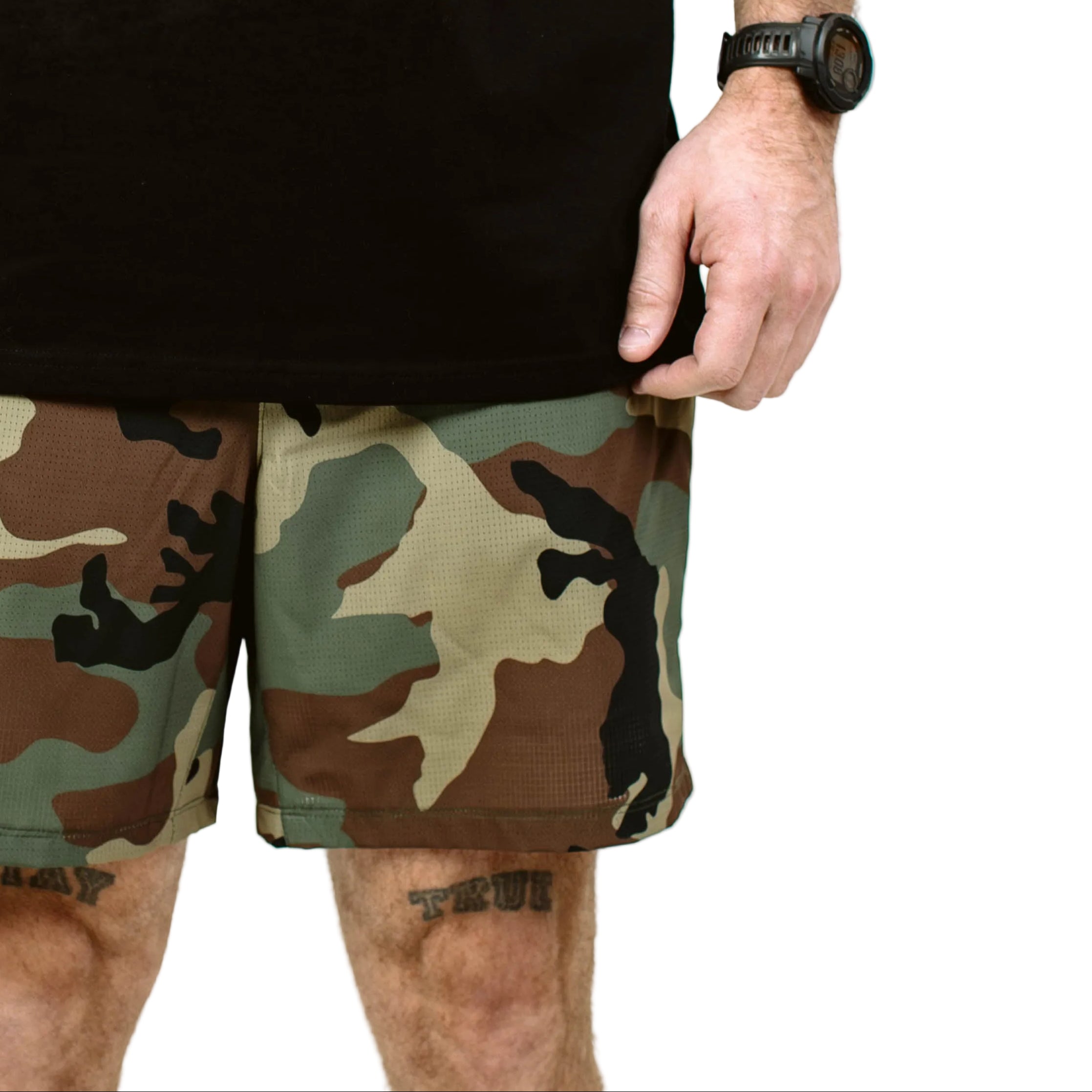 Close up of TD Contender Training Shorts fabric showing micro perforated breathable weave, lightweight quick dry stretch material engineered for airflow, sweat management, and high intensity tactical fitness sessions