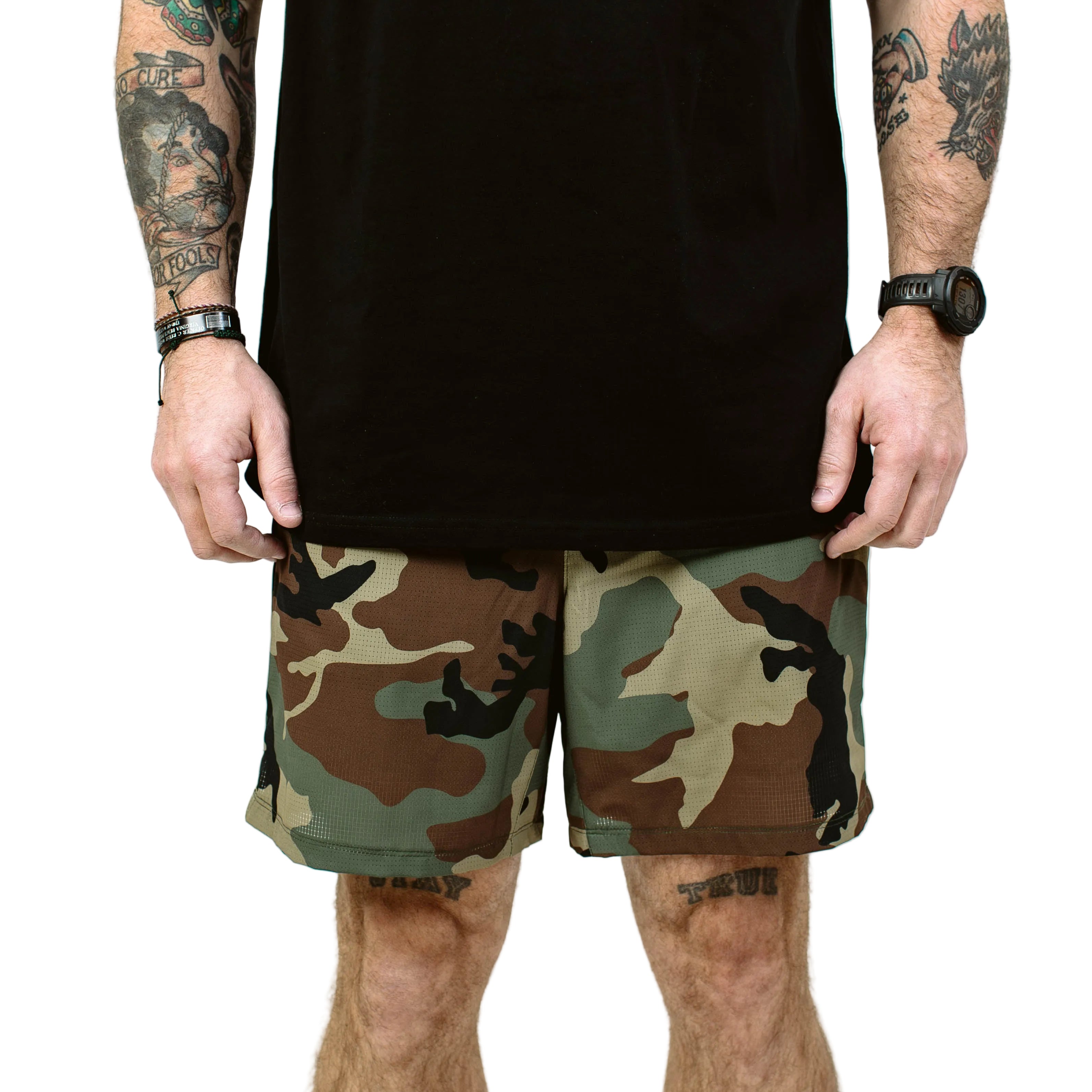 TD Contender Training Shorts in Woodland camo front product photo, breathable tactical training shorts with quick dry stretch fabric, mesh drainage pockets, and athletic 7 inch inseam built for cross training, rucking, and hot weather workouts