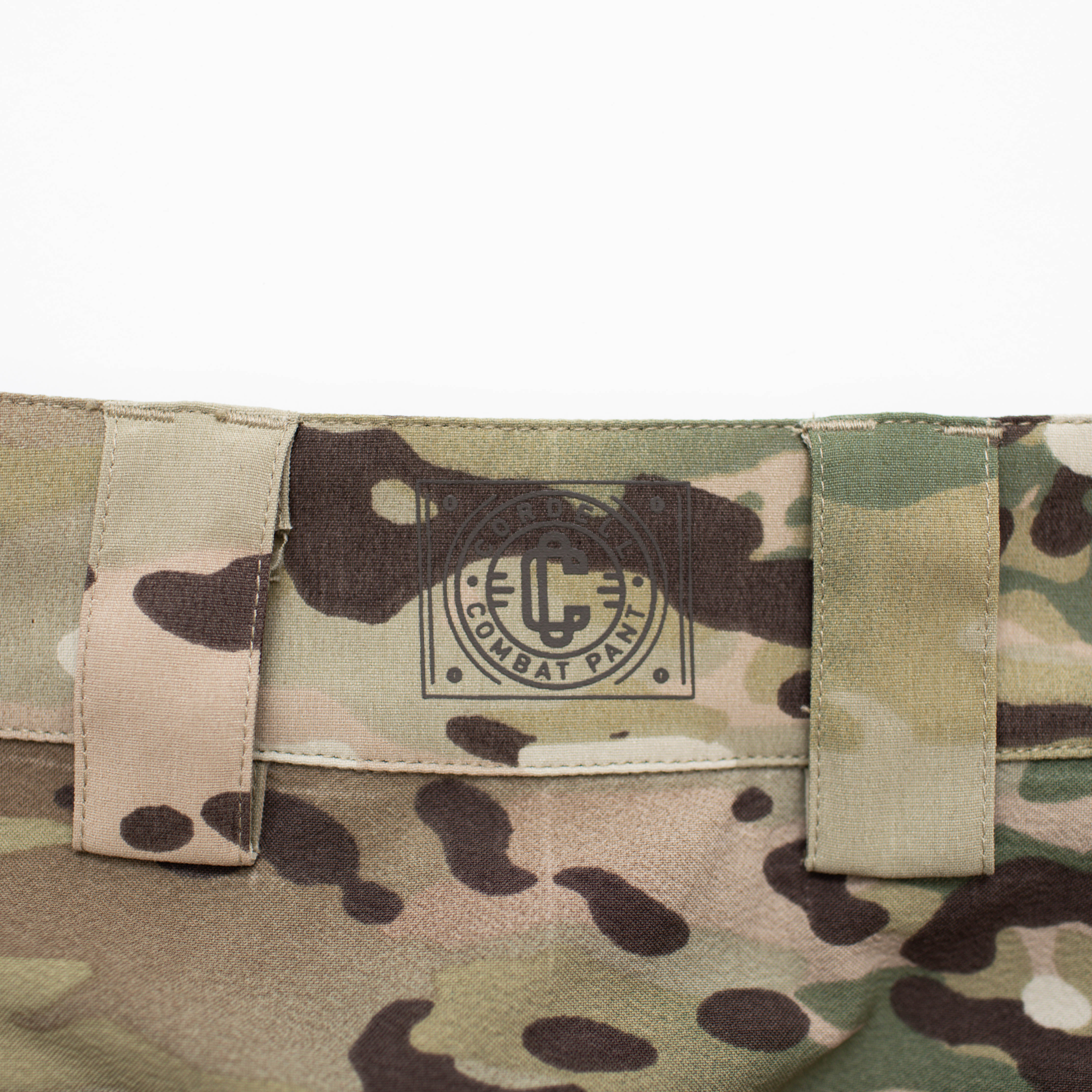 Close-up of TD Cordell Amphib Combat Pants V2 in MultiCam® Agility showing rear branding detail and reinforced stitching. Amphibious tactical pants built with Brookwood quick-dry fabric and designed for durability, mobility, and EDC-ready performance in training or deployment.