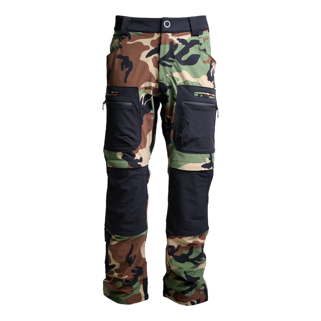 Front view of the TD Cordell Combat Pants V2 in the Colorblocked M81 Woodland and Black version, showing the double-weave softshell chassis, articulated knees, gusseted crotch, and full eleven-pocket EDC layout. Highlights the contrasting M81 Woodland camo paired with black reinforcement panels, mesh-backed thigh vents, wide belt loops, and knee-pad compatible pockets. Perfect for users searching for M81 Woodland tactical pants, colorblocked combat pants, or high-mobility EDC trousers designed for range day