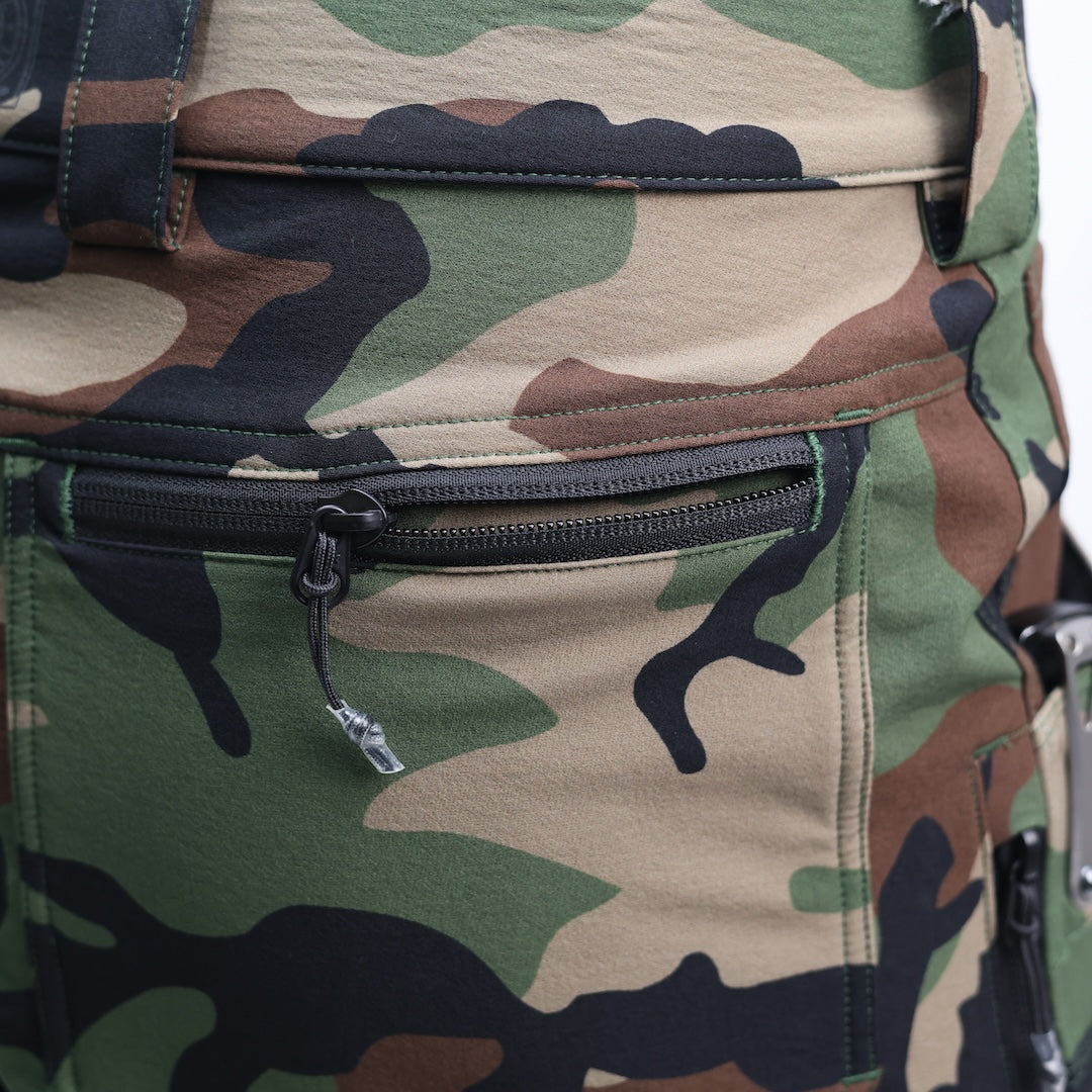 Close-up of the TD Cordell Combat Pants V2 in M81 Woodland showing the rear zip pocket with durable YKK zipper construction. Highlights the secure storage design for EDC items, reinforced stitching, and rugged softshell fabric built for tactical movement and field durability. Ideal for users searching for M81 Woodland combat pants with secure zip pockets, reliable EDC storage, and professional-grade construction.