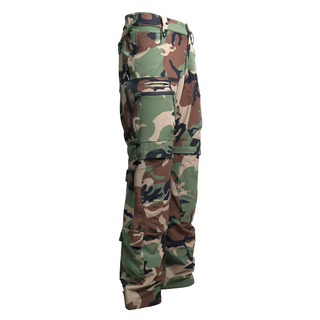 Side view of the TD Cordell Combat Pants V2 in the M81 Woodland colorway, showing the mesh-backed thigh vent zipper, welted AR mag pocket, articulated knee shaping, and reinforced knife-panel placement. Highlights the streamlined fit, mobility-focused design, and multi-pocket EDC storage layout. Ideal for users searching for M81 Woodland combat pants with ventilation, field-ready functionality, and high-mobility construction.