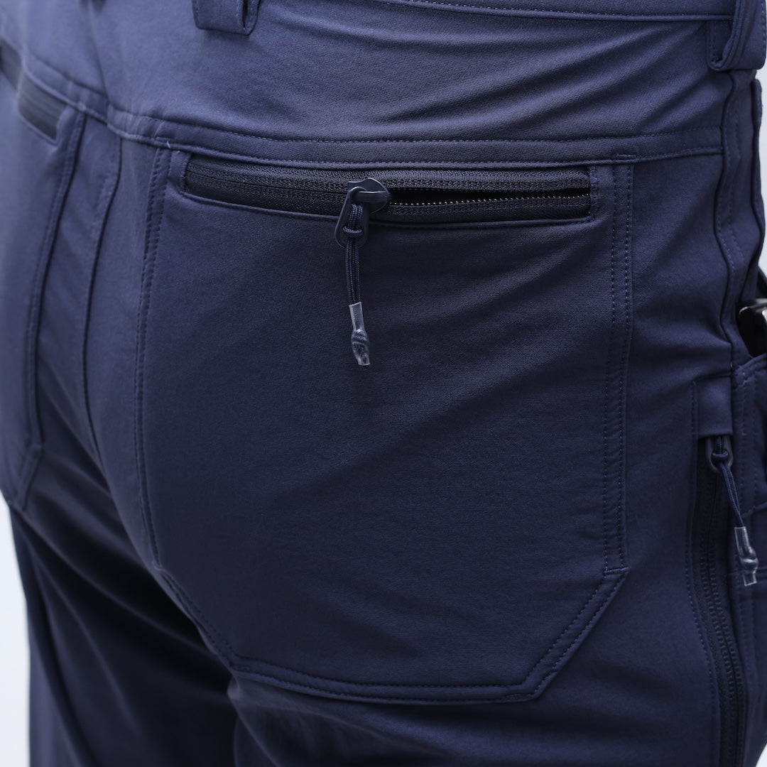 Close-up of the TD Cordell Combat Pants V2 in Navy Blue showing the zippered rear pocket with a durable YKK zipper and reinforced stitching. Highlights secure storage for EDC items, rugged double-weave softshell construction, and long-term durability for field use. Ideal for users searching for navy tactical pants with secure zipper pockets, EDC-ready combat pants, or dependable storage for range and everyday carry setups.