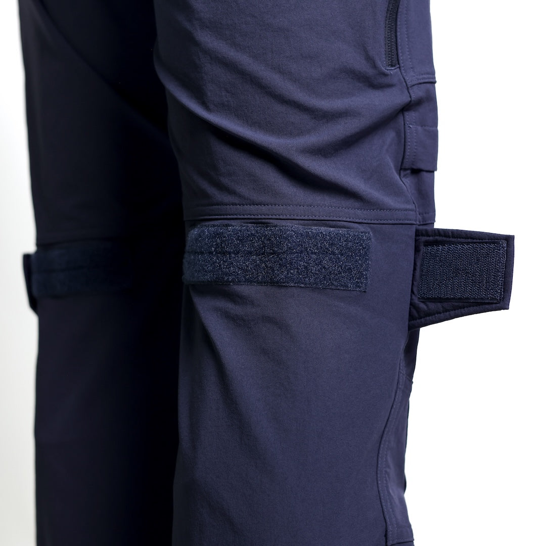 Close-up of the TD Cordell Combat Pants V2 in Navy Blue showing the hook-and-loop knee adjustment system used to tighten the fit and stabilize knee pads during movement. Highlights the reinforced construction, ergonomic knee articulation, and customizable fit ideal for users searching for tactical pants with knee adjustment, Navy Blue combat pants with knee pad support, or field-ready trousers built for mobility and durability.