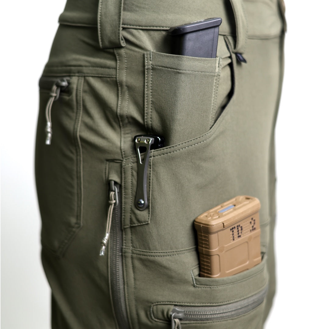 Close-up detail of the TD Cordell Combat Pants V2 in Ranger Green showing the reinforced pocket construction, including the knife-clip panel and easy-access EDC pocket layout. Highlights durable stitching, softshell abrasion resistance, and functional storage designed for everyday carry, range sessions, and tactical field use. Ideal for users searching for Ranger Green tactical pants with reinforced pockets, EDC-friendly storage, and combat-ready durability.