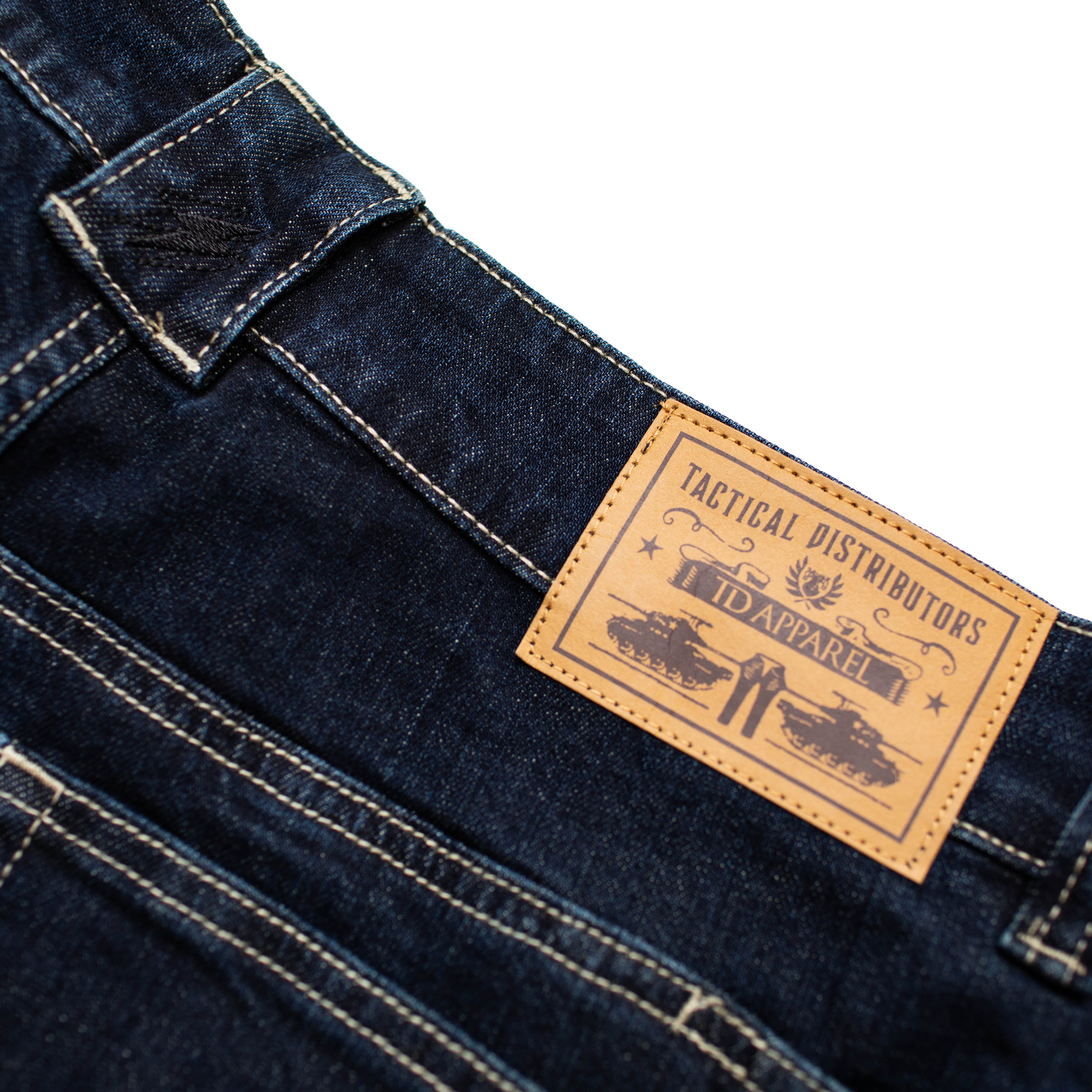 Close view of the TD McQuade Tactical Jeans back waistband showing the reinforced belt loops, discreet handcuff key pocket, and durable construction designed for concealed carry and EDC tactical use.