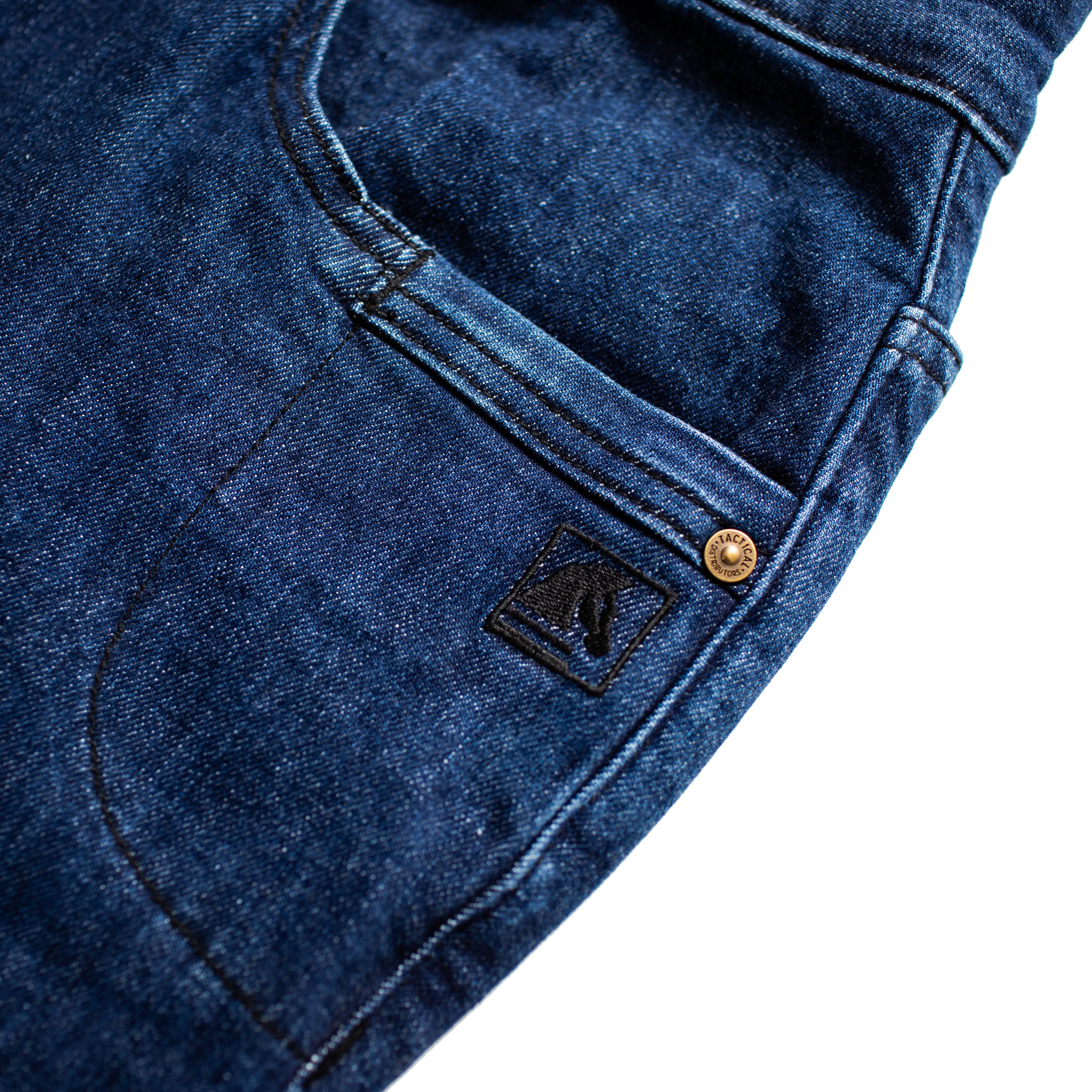 Front pocket layout of the TD McQuade Tactical Jeans in the Midnight wash showing the reinforced stitching, branded rivet details, knife pocket placement, and concealed carry friendly EDC pocket design for users searching for the best tactical jeans, CCW denim, and everyday carry pants.