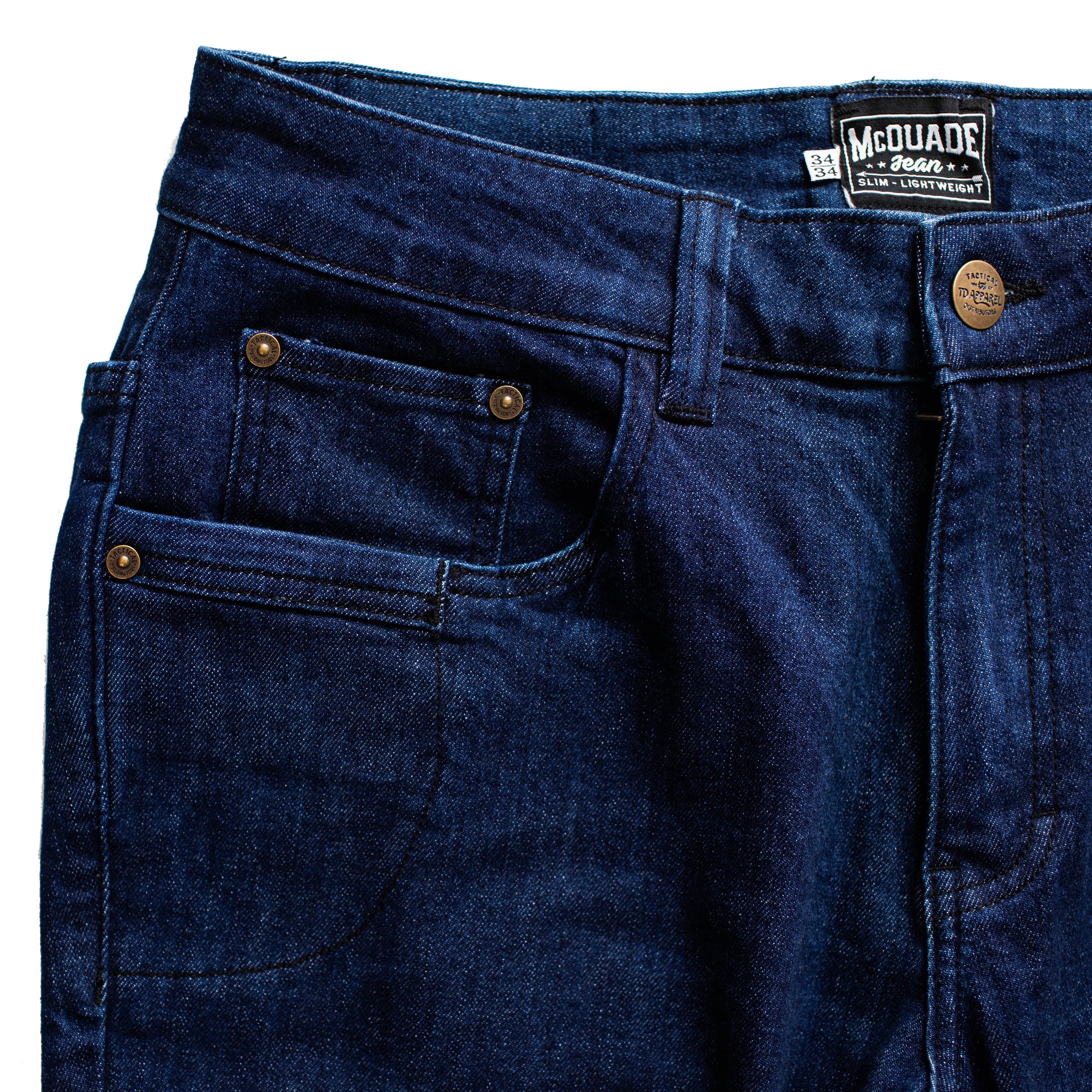 Close up of the TD McQuade Tactical Jeans in the Midnight wash showing the reinforced waistband, heavy duty belt loops, front pocket layout, and discreet EDC friendly design for users searching for the best tactical jeans, CCW pants, and everyday carry tactical denim.
