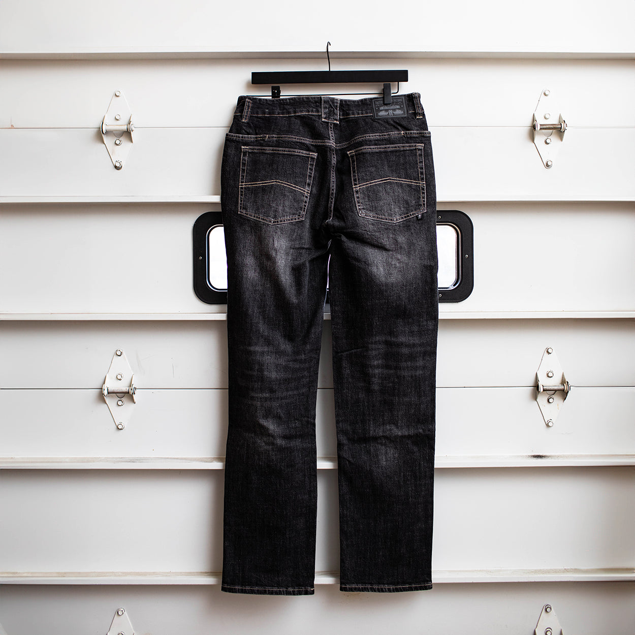 Back view of the TD McQuade Tactical Jeans in the Vintage Black regular cut showing the reinforced rear pockets, AR mag compatible EDC yoke pockets, and concealed carry optimized stretch tactical denim designed for users searching for the best tactical jeans and everyday carry pants.