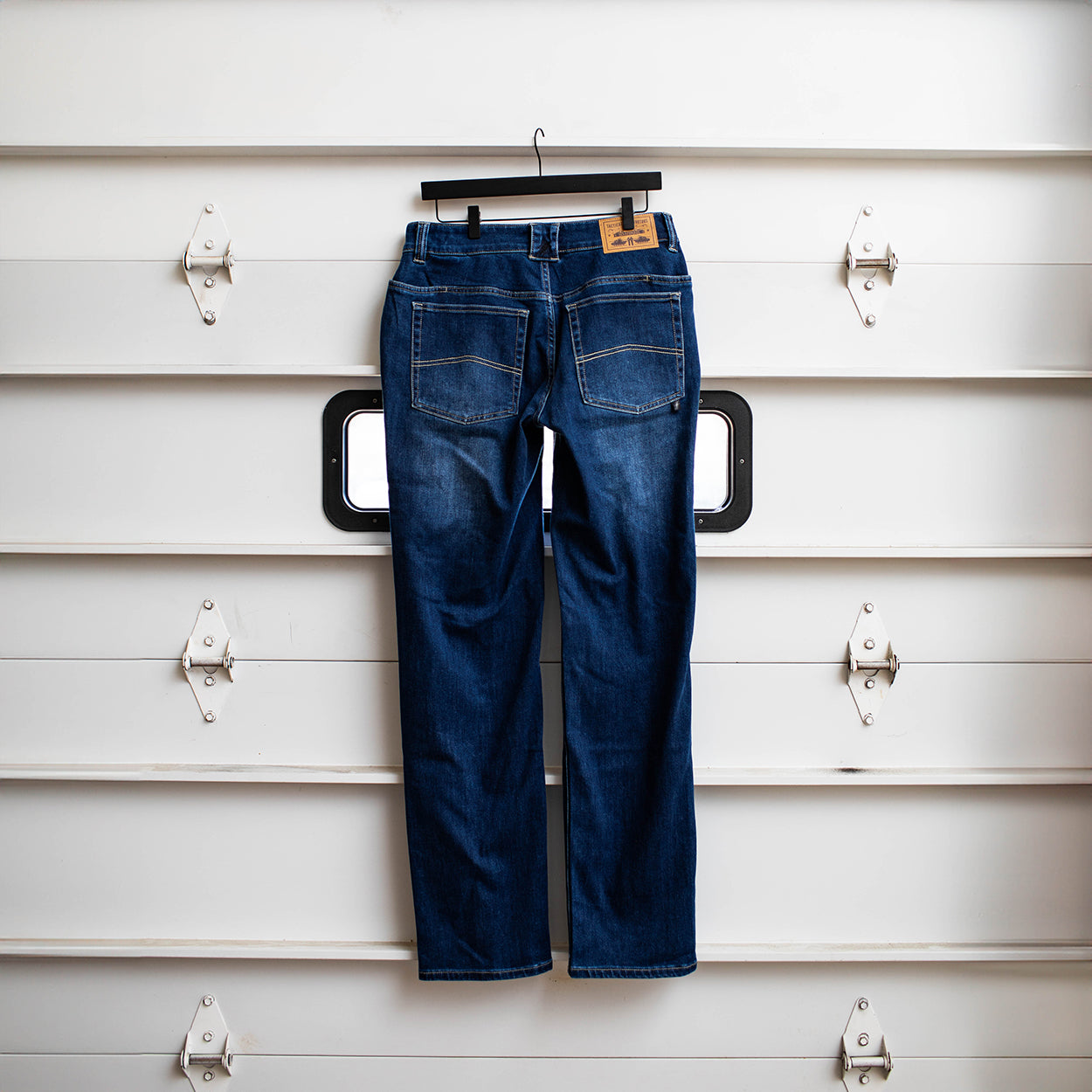 Back view of the TD McQuade Tactical Jeans in the Vintage wash regular cut showing the reinforced rear pockets, AR mag compatible EDC yoke pockets, and concealed carry optimized stretch tactical denim designed for users searching for the best tactical jeans, CCW pants, and everyday carry denim.