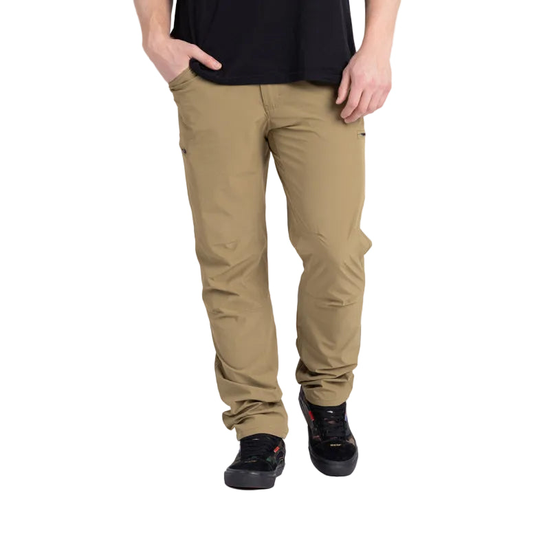Front view of the TD Neptune Slim Pants in Dark Desert Sand, designed for tactical performance. Made from quick-dry, water-repellent DWR-treated fabric, these slim-fit pants offer mobility and durability for outdoor, tactical, or EDC use. With multiple pockets, including AR mag thigh slots and pistol-mag coin pockets, they provide secure storage without sacrificing comfort or style.