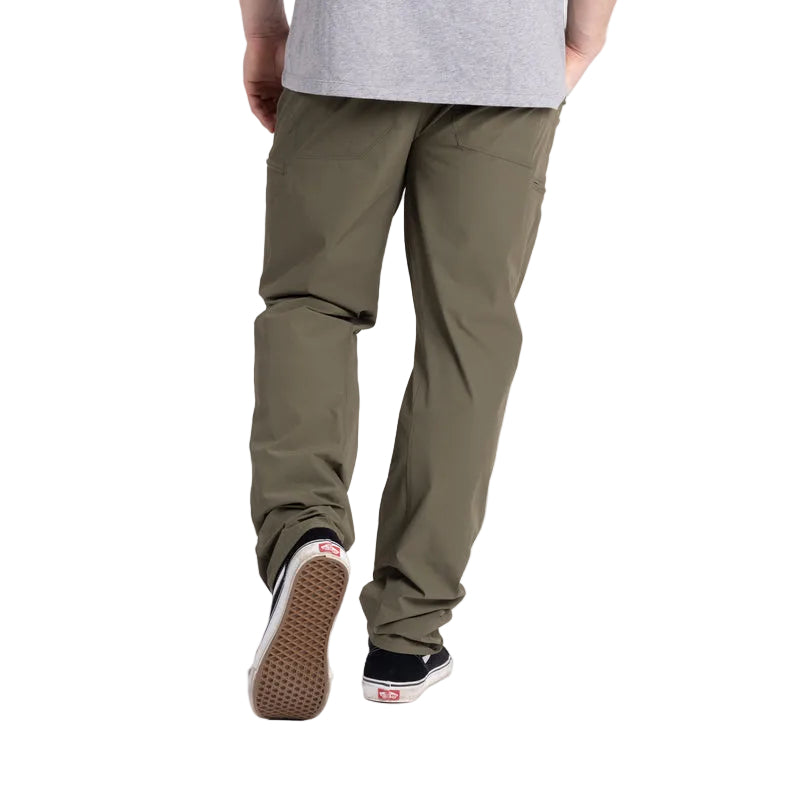 Back view of the TD Neptune Slim Pants in Ranger Green, showcasing the 8-pocket EDC storage system. Designed for tactical efficiency, these slim-fit pants feature zippered back pockets, dual pistol mag coin pockets, and AR mag thigh slots. Built with water-repellent DWR-treated micro rip-stop nylon and 2-way stretch for mobility, these pants provide quick-dry comfort for any mission.