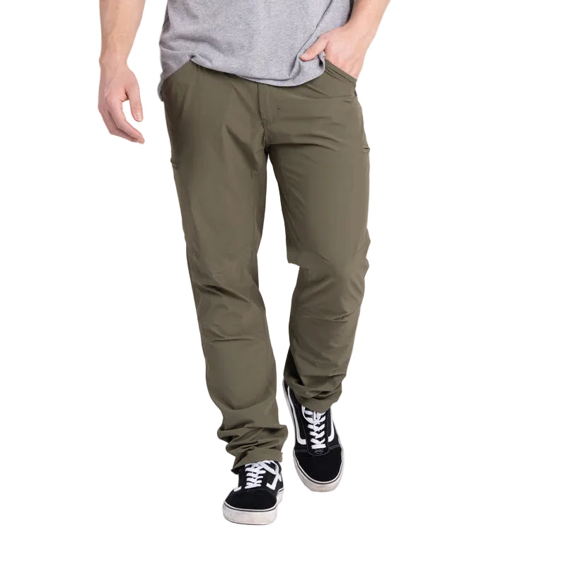 Action shot of the TD Neptune Slim Pants in Ranger Green, designed for optimal movement. Featuring a slim fit and built with DWR-treated micro rip-stop nylon, these amphibious tactical pants offer quick-dry, breathable comfort. Perfect for walking, climbing, or outdoor activities, they provide flexible mobility and 8-pocket EDC storage, including AR mag thigh slots and pistol-mag coin pockets.