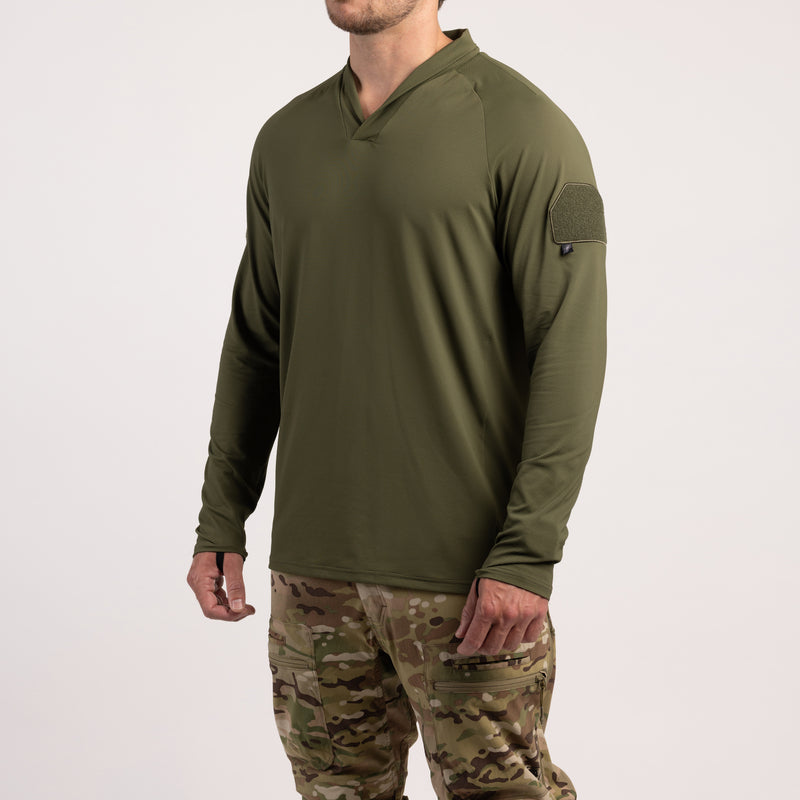 Three-quarter view of TD OSS Operator Shooter Shirt in Ranger Green showing loop field placement on the bicep for patches and the modern shawl collar that protects the neck from sling burn and armor rub. Made from lightweight four-way stretch moisture-wicking fabric for tactical base layer performance