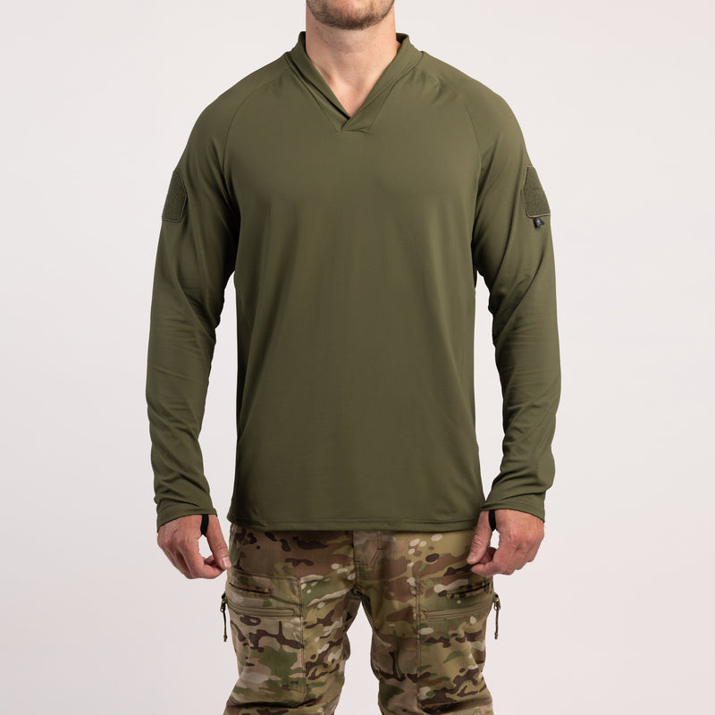 Front view of TD OSS Operator Shooter Shirt in Ranger Green highlighting athletic fit, lightweight four-way stretch fabric, moisture-wicking performance, UV protection, modern shawl collar, raglan sleeves, and low-profile loop fields for patches. This tactical base layer is built for range days and real-world missions