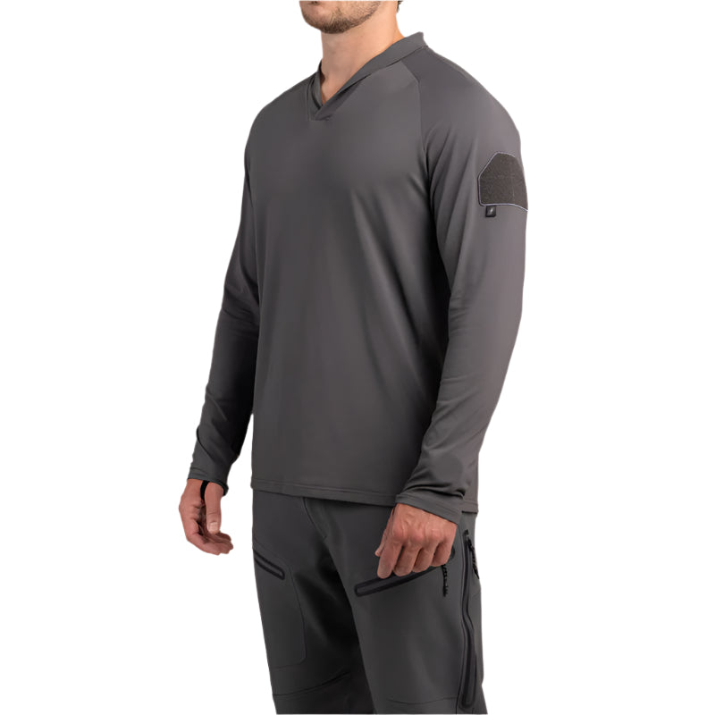 Three-quarter view of TD OSS Operator Shooter Shirt in Wolf Grey highlighting loop field for arm patches, modern shawl collar that guards against sling rub, and athletic cut with raglan sleeves for unrestricted movement. Constructed from lightweight moisture-wicking four-way stretch fabric, this high-performance range shirt is a must-have base layer for serious shooters