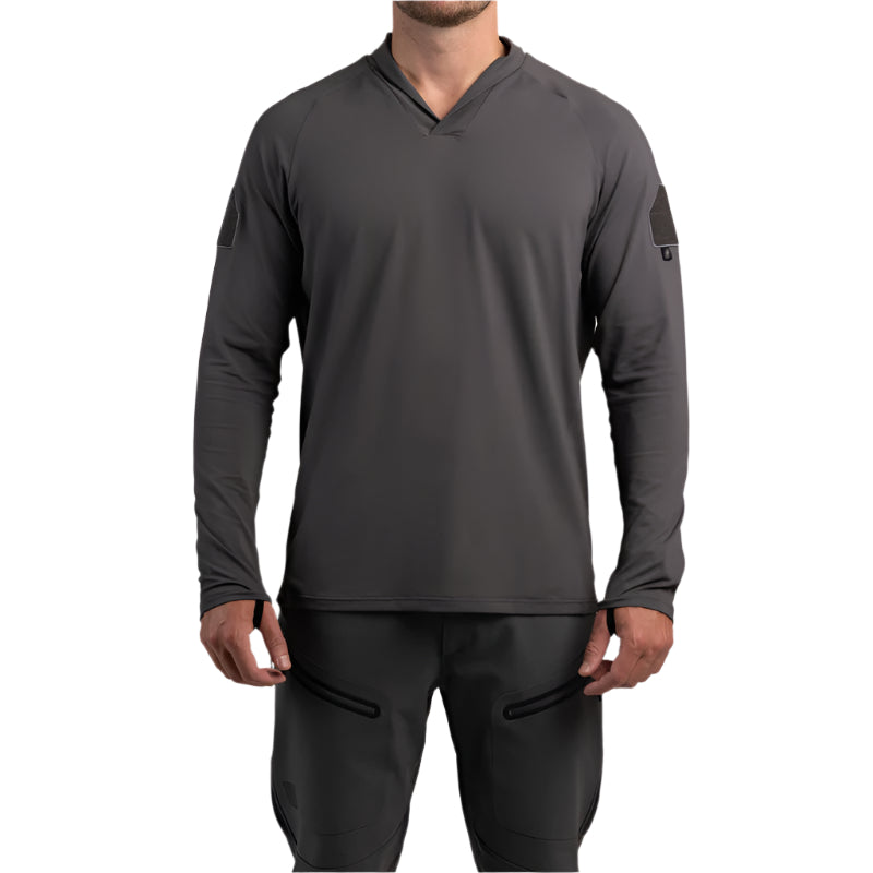 Front view of TD OSS Operator Shooter Shirt in Wolf Grey showing streamlined athletic fit with moisture-wicking four-way stretch fabric, UPF sun protection, and a modern shawl collar to prevent neck abrasion from slings or armor. Designed as an operator-approved tactical base layer for the range, training, or mission-ready wear
