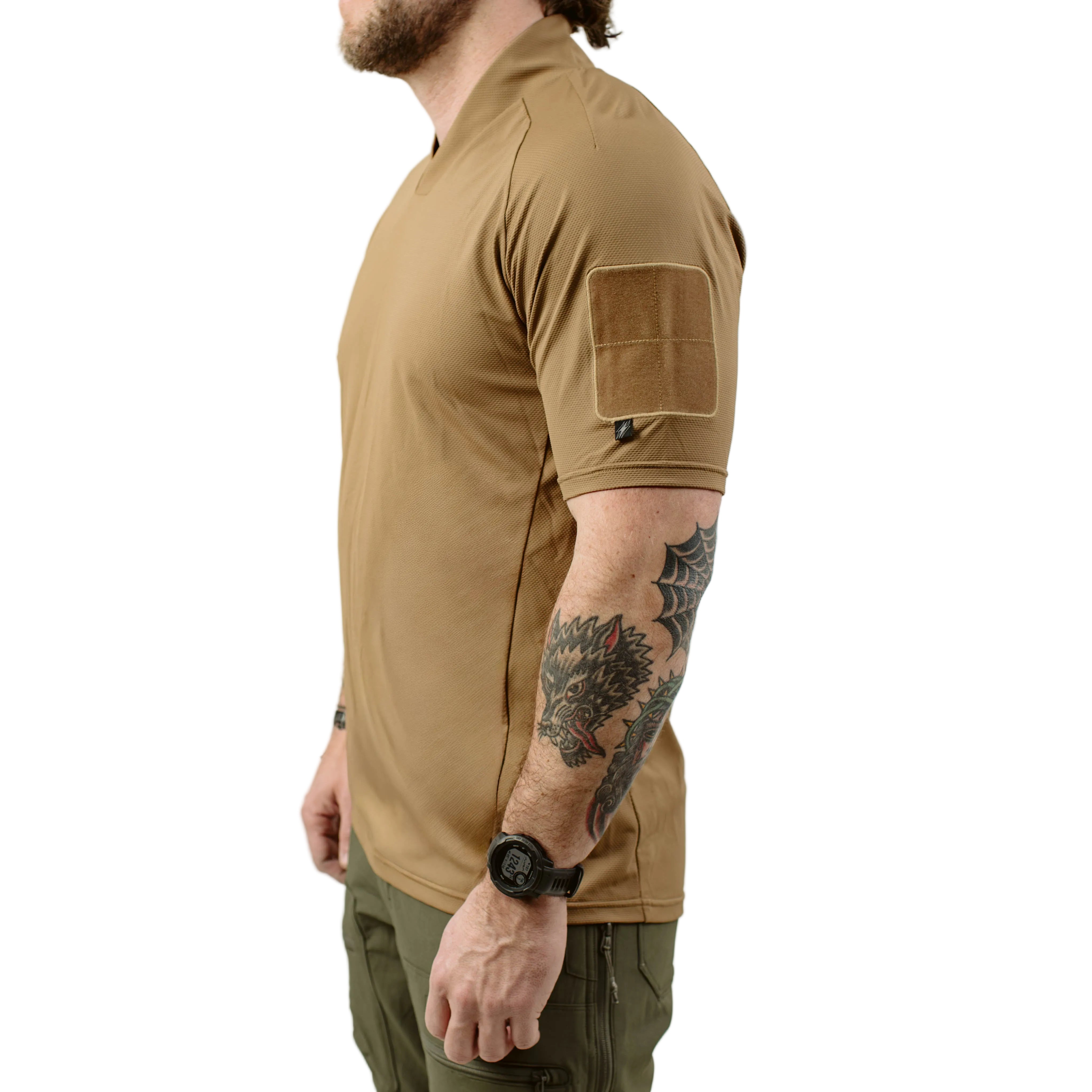 Side profile of TD OSS Top Short Sleeve in Coyote showing athletic combat base layer fit, raglan sleeves, and low bulk patch field, warm weather tactical range shirt built for high output training and operational environments