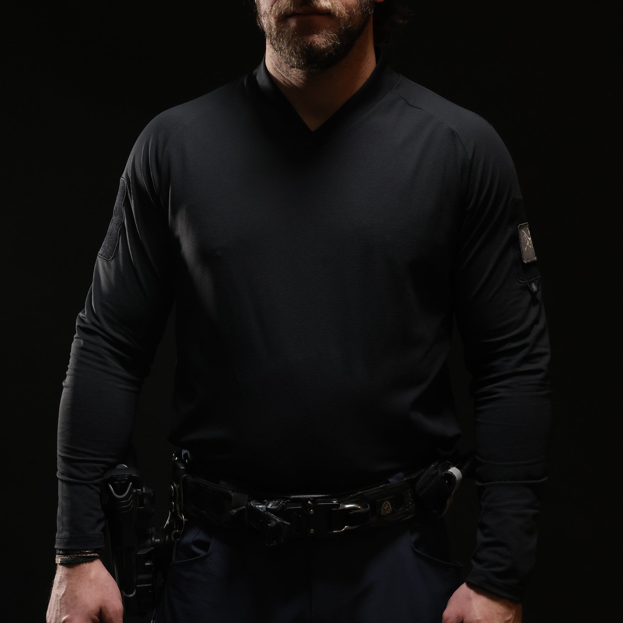 Front view of TD OSS Top V2 Long Sleeve in Black worn in full tactical uniform kit, lightweight combat base layer operator top and shooter shirt built for range training, law enforcement duty, and professional wear under plate carriers