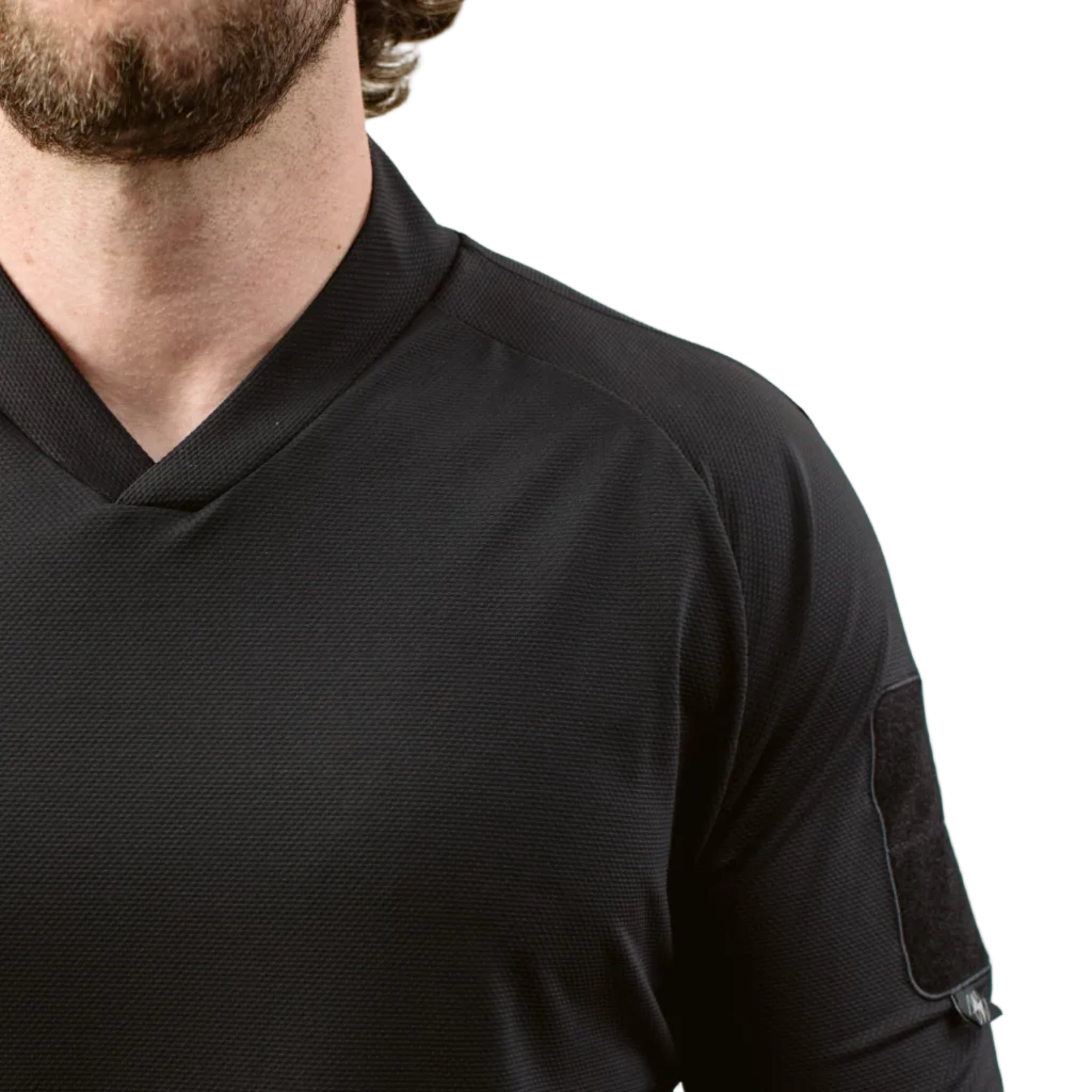 Close up of TD OSS Top V2 Long Sleeve in Black showing front shoulder seam construction and raglan sleeve articulation, lightweight tactical combat base layer operator shirt designed for range training, shooter use, and duty wear under plate carriers