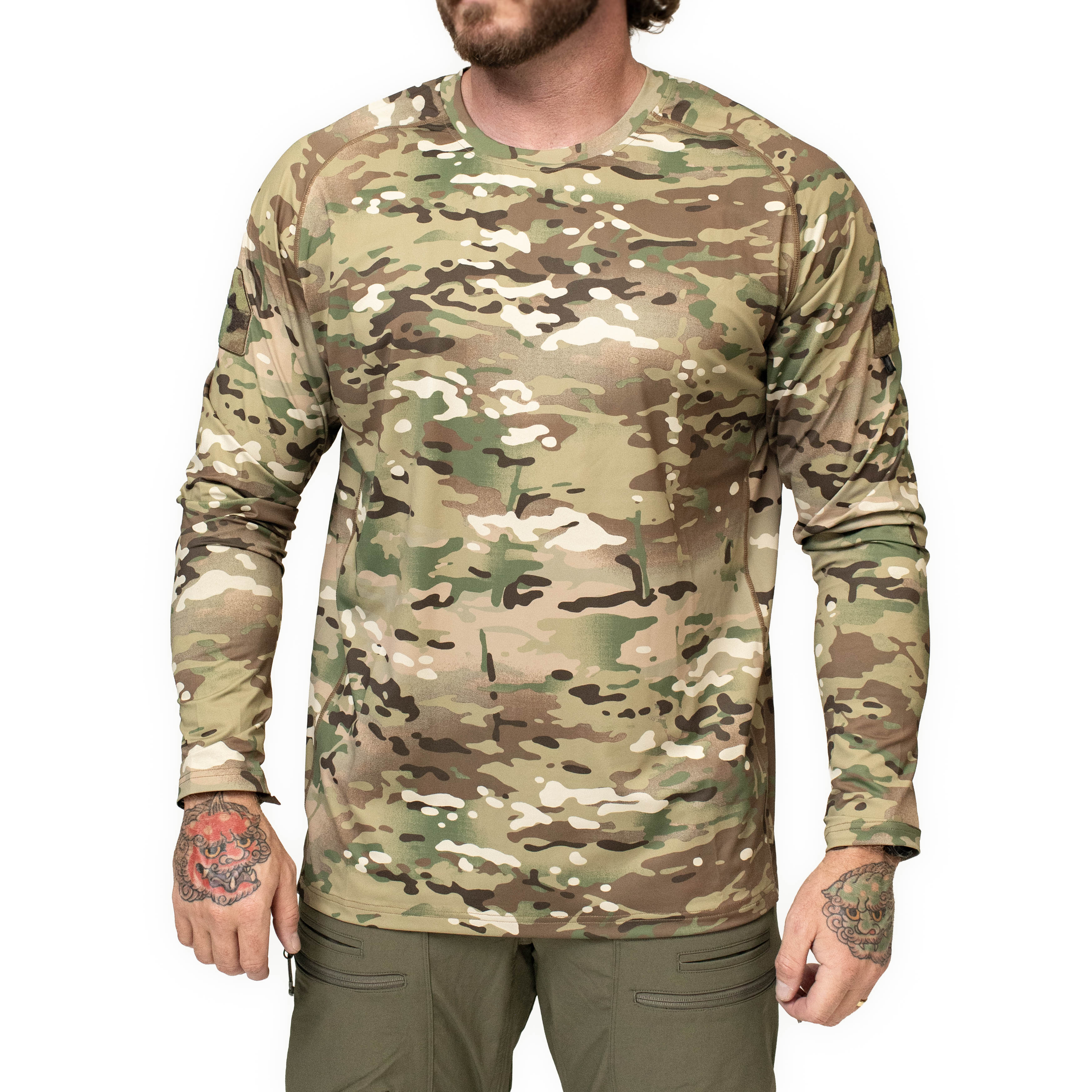 Front product view of the TD Shooter Shirt in official MultiCam showing the long sleeve design, 4 way stretch moisture wicking fabric, raglan sleeves, and MIL SPEC MultiCam loop bicep patches built for tactical training and range use. Available from Tactical Distributors in Virginia Beach for U.S. shooters, operators, and outdoor athletes.