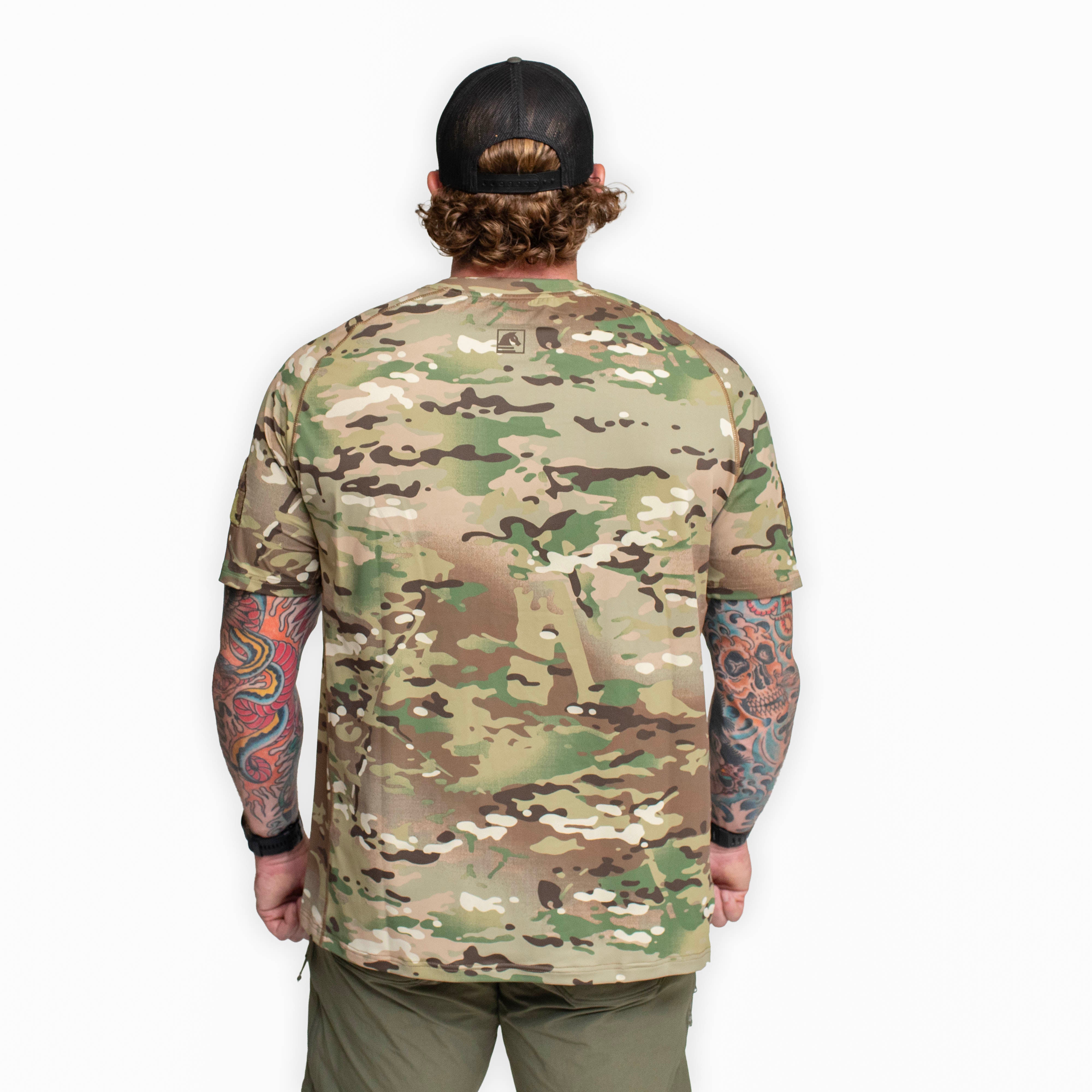 Back view of the TD Shooter Shirt MultiCam short sleeve showing the clean athletic fit, wrapped side body panels, and breathable performance fabric designed for mobility during range sessions, training days, and outdoor use. Available nationwide from Tactical Distributors based in Virginia Beach.