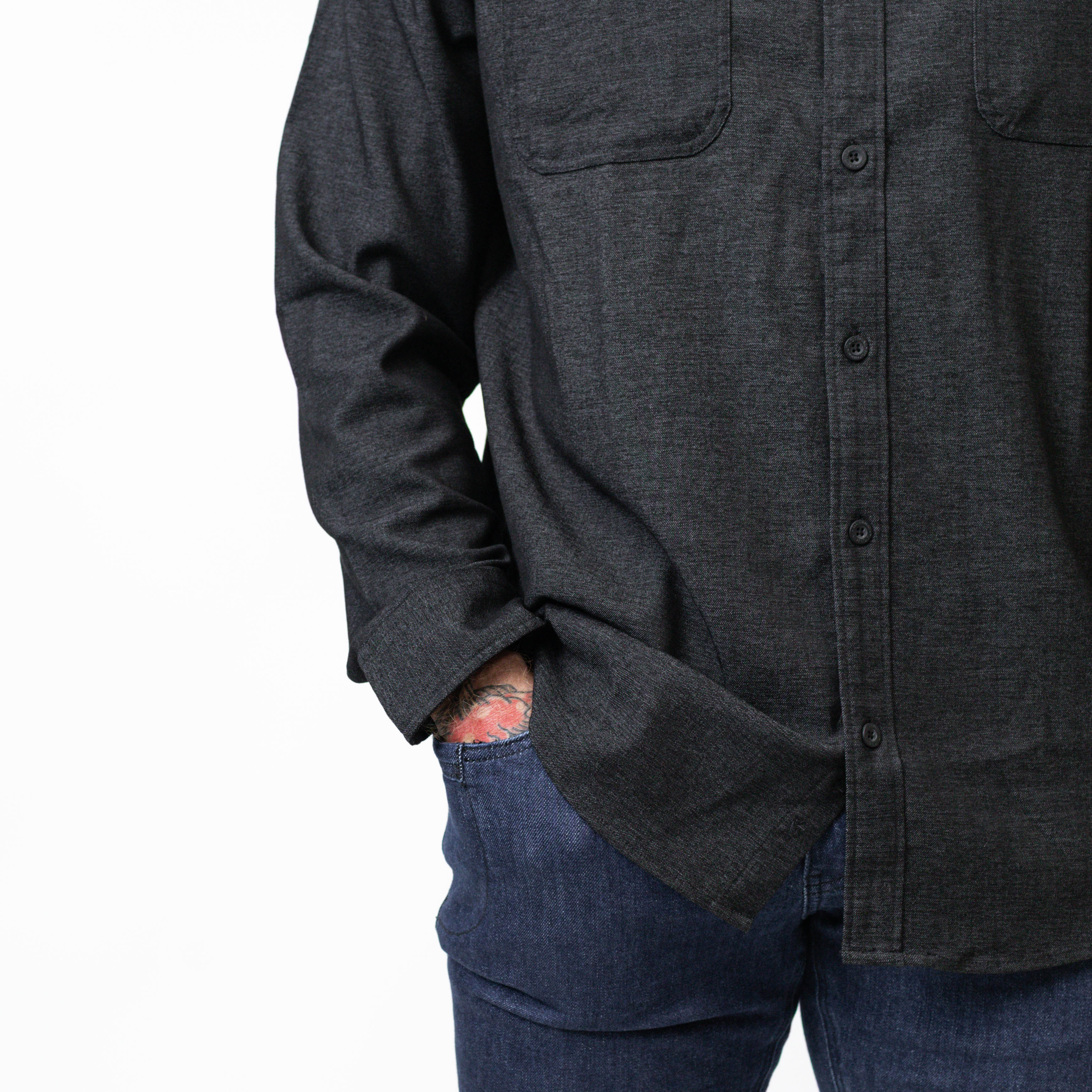 Close-up of the black TD Stretch Flannel Work Shirt heathered color and buttons, showing premium tactical work apparel craftsmanship in a soft, comfortable flannel.