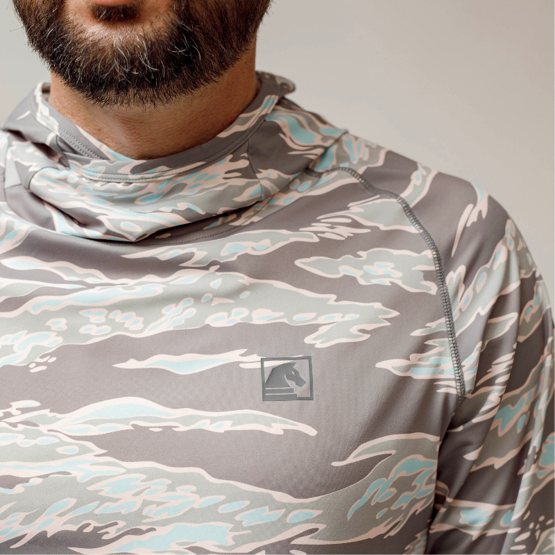 Close-up detail of the TD Outdoor Tiger Shark Sun Shirt 3.0 in Miami Tiger Fade, highlighting breathable performance fabric, flatlock stitching, and bold camo pattern.