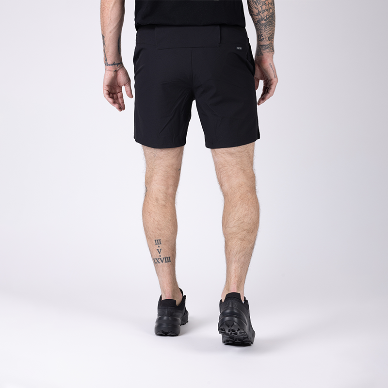 Back view of TD Workup Athletic Shorts in Black showcasing the clean tactical design with a secure performance waistband, subtle back branding, and lightweight stretch ripstop fabric. These athletic shorts provide EDC-ready pocketing and gusseted construction for unrestricted movement, making them perfect for intense training sessions, running, and tactical workouts