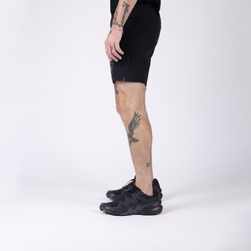 Side view of TD Workup Athletic Shorts in Black showing the athletic fit, gusseted leg construction for unrestricted movement, and secure phone pocket placement. These tactical training shorts use lightweight stretch ripstop fabric and a comfortable waistband, making them perfect for running, lifting, and everyday tactical fitness sessions