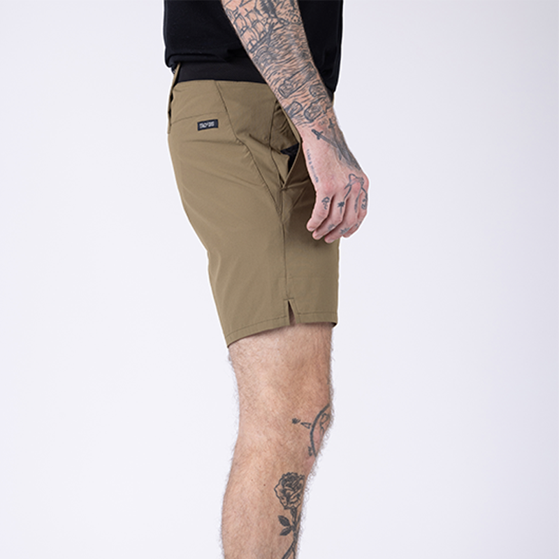 Additional side view of TD Workup Athletic Shorts in Nile Brown highlighting the gusseted leg design and stretch ripstop fabric that allow full range of motion during squats, sprints, and tactical training. The secure phone pocket and performance waistband ensure these athletic shorts stay in place for everyday workouts and rugged field use