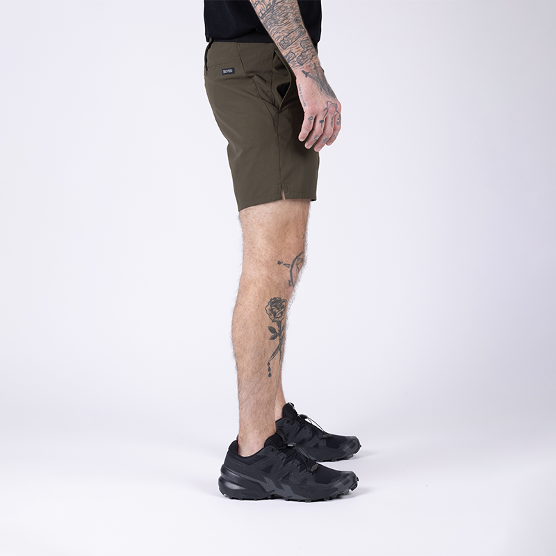 Side view of TD Workup Athletic Shorts in OD Green highlighting the practical side pockets for EDC storage, breathable side vent detailing for added airflow, and subtle branding for a tactical athletic look. These stretch ripstop performance shorts offer comfort, durability, and versatility for training, running, and everyday active wear