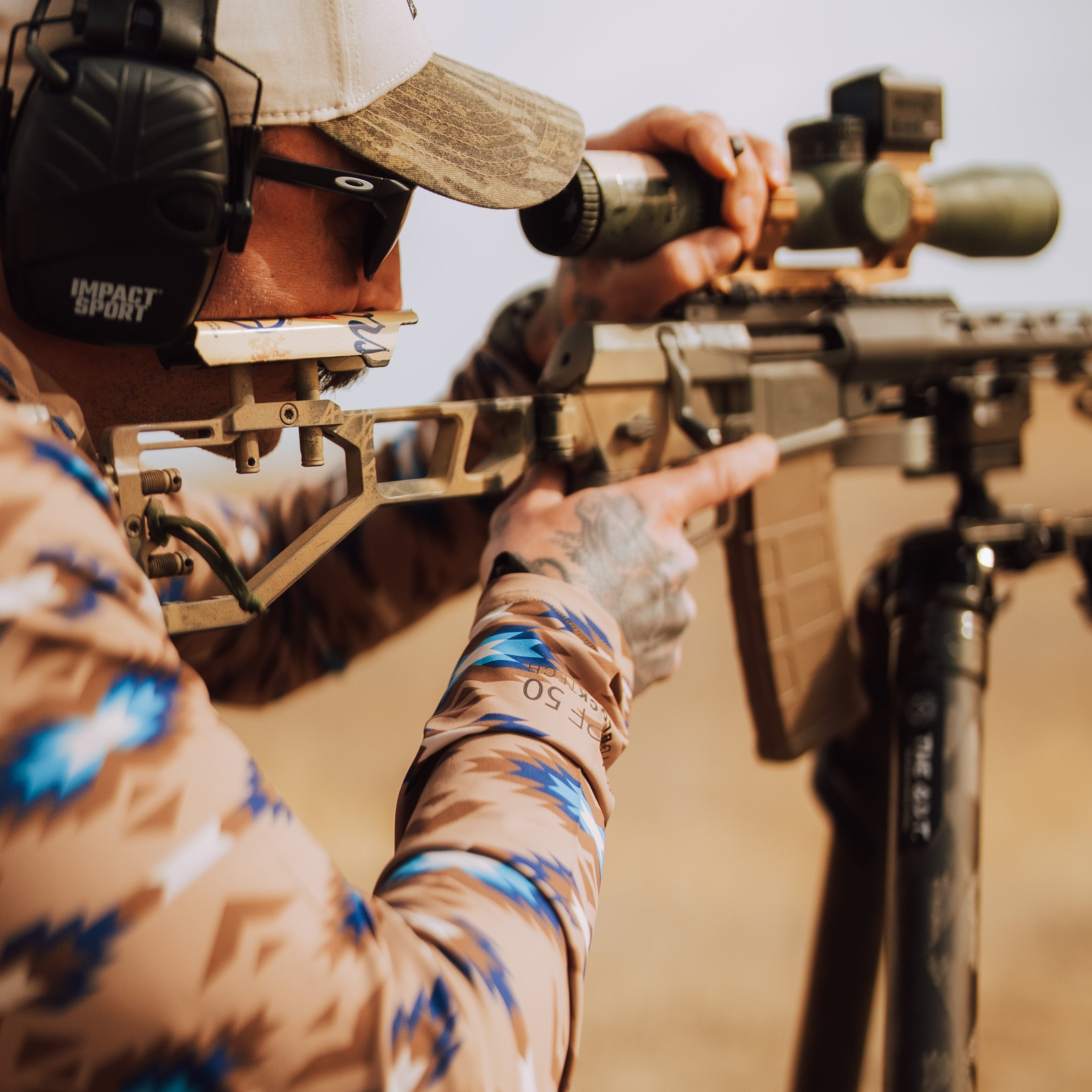 TD x Black Canyon Systems Southwest Tan tactical hooded sun shirt worn during live fire training, lightweight UPF 50 shooting hoodie with moisture wicking stretch fabric built for hot weather range days and high output firearm drills