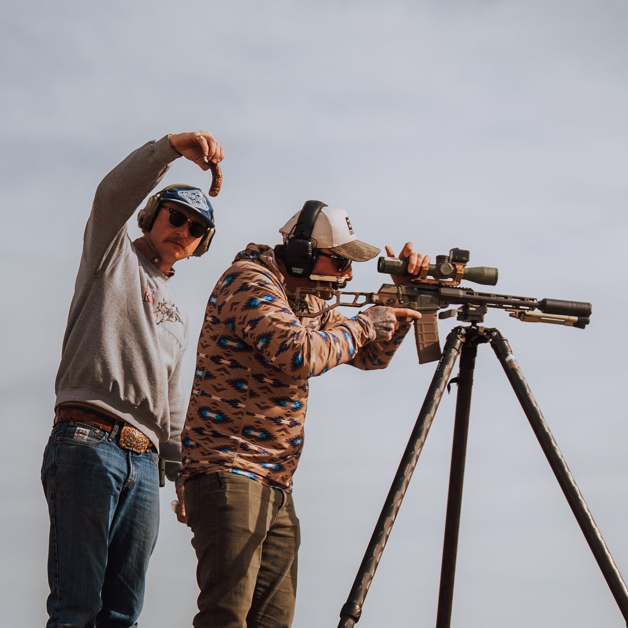 TD x Black Canyon Systems Southwest Tan hooded sun shirt worn during live fire range training, lightweight tactical sun hoodie with UPF 50 protection and 4 way stretch fabric built for high heat shooting sessions and extended outdoor drills
