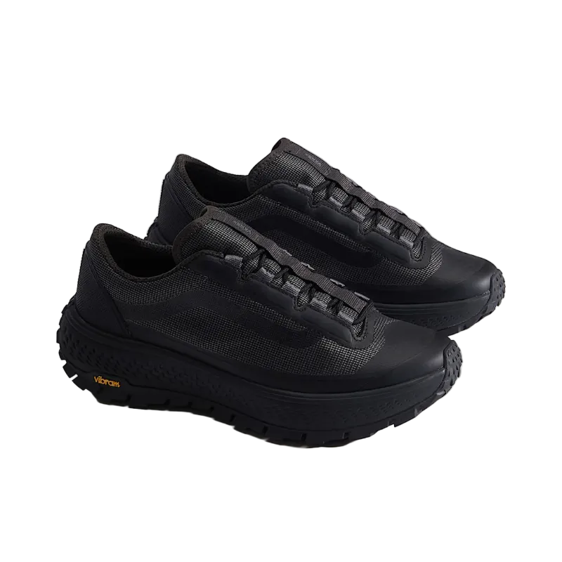 Pair of black sneakers on a light gray background