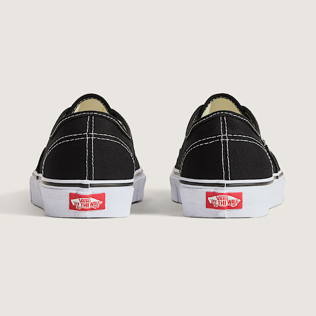 Rear view of Vans Authentic Shoes in Black and White highlighting the iconic Vans heel tab and classic vulcanized construction.