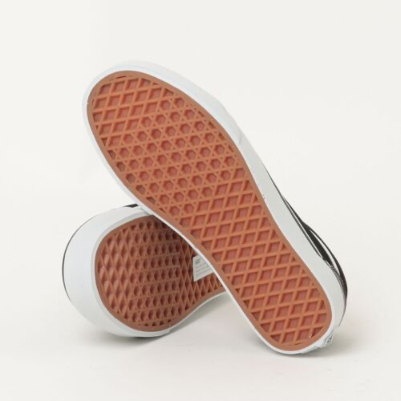 Bottom view of Vans Old Skool brown black skate sneaker showing signature waffle rubber outsole traction pattern